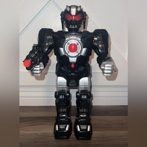 15" BATTERY OPERATED ROBOT TOYS. LIGHTS UP, TALKS, MAKES SHOOTING SOUNDS & WALKS